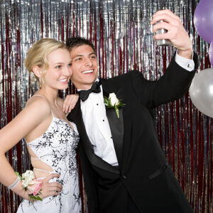 Teenagers at Prom taking a selfie picture